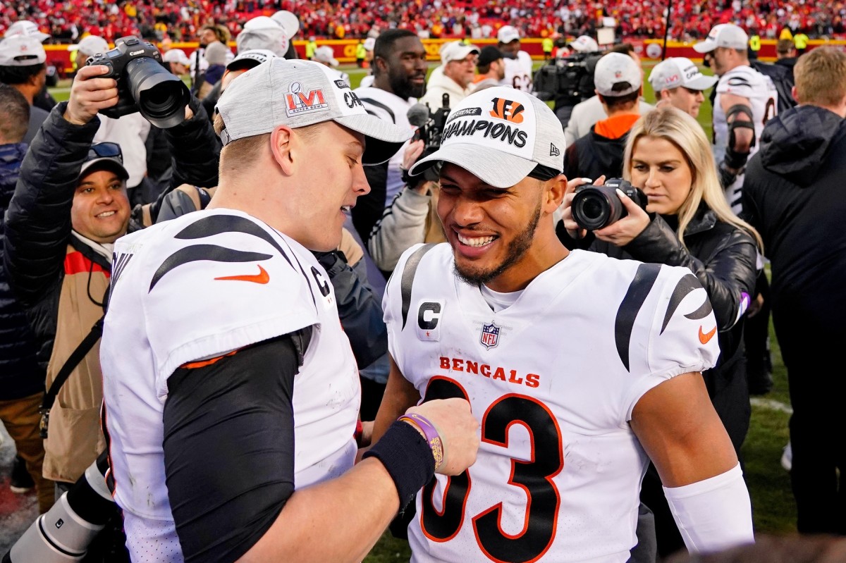 Jan 30, 2022; Kansas City, Missouri, USA; Cincinnati Bengals quarterback Joe Burrow (left) and wide receiver Tyler Boyd (83) celebrate after winning the AFC Championship Game against the Kansas City Chiefs at GEHA Field at Arrowhead Stadium. The Cincinnati Bengals won 27-24. Mandatory Credit: Jay Biggerstaff-USA TODAY Sports